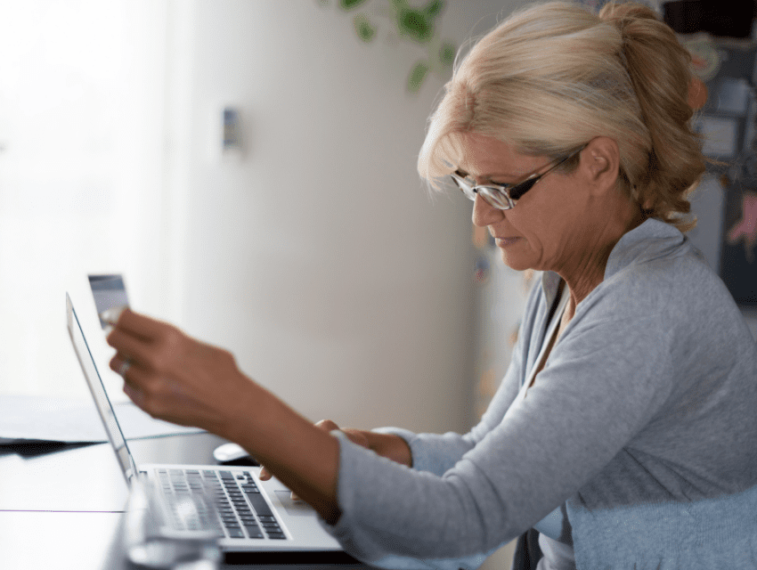 pamela sandall design _ los angeles california _ woman with credit card looking at laptop and shopping online _ how to determine an accurate timeline for your project