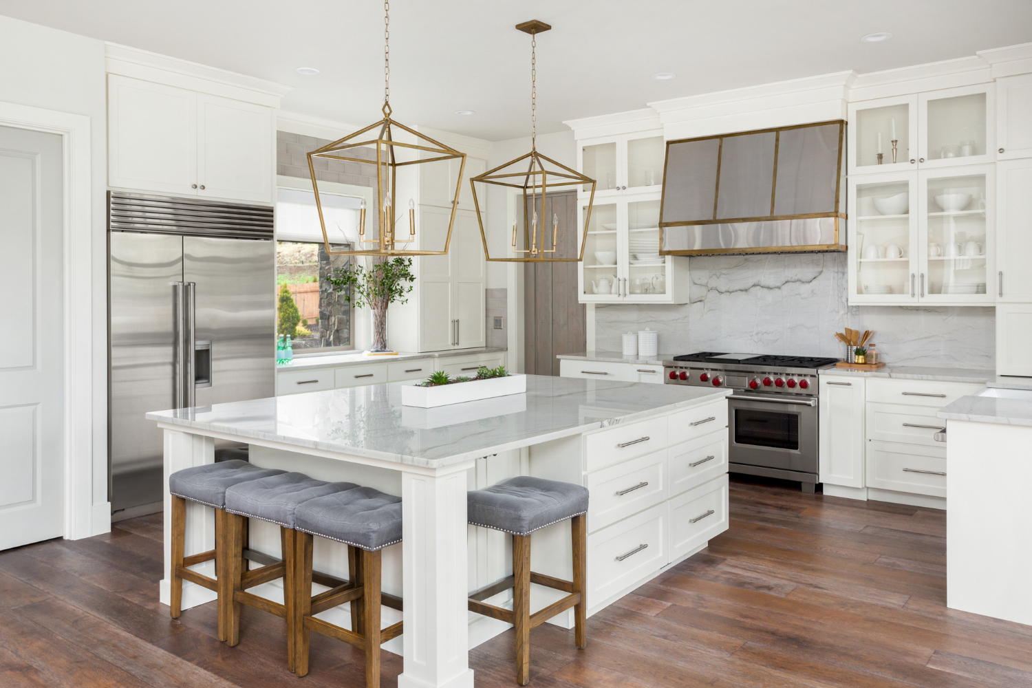 full-service-interior-designer-new-construction-torrance-ca-design-answers-to-questions-luxury-kitchen-large-island-with-bar-stools-custom-range-hood-white-cabinets-transitional-home-staging